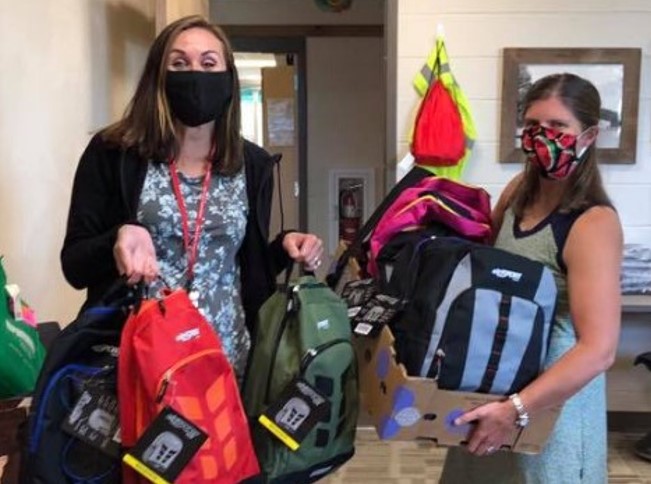 Members of Chapter 1391 donating backpacks to a local school