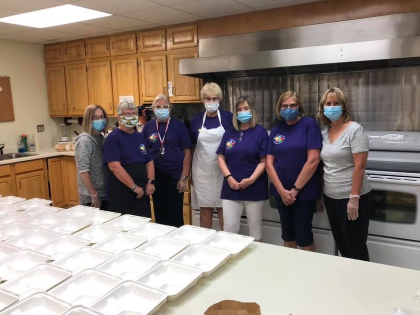 Members of Chapter 5052 serving a spaghetti dinner.