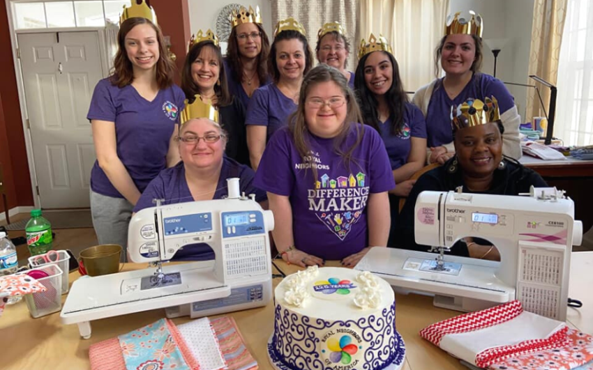 Members of Chapter 30011 celebrating Royal Neighbors' 125th anniversary with cake and crowns.