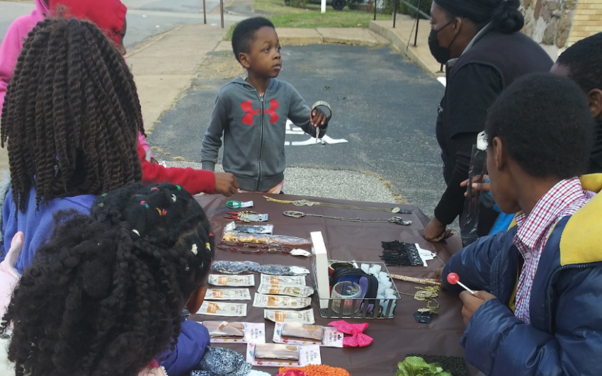 Chapter 20212 youth members selling items at a fundraising event.