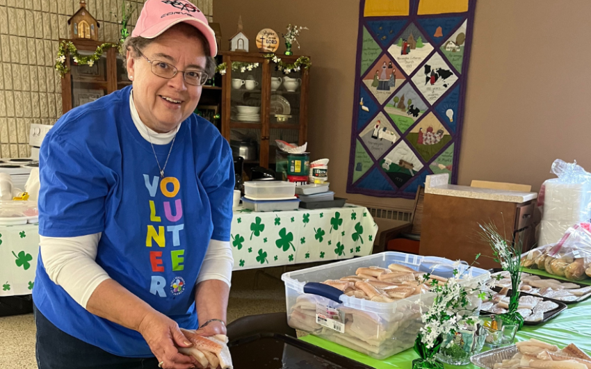 Member Dawn Dingeldein preparing for a fish fry fundraiser