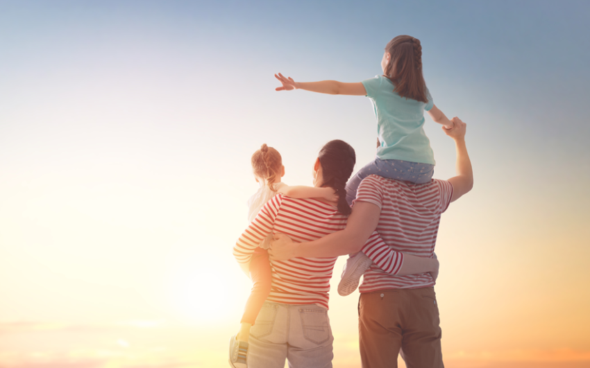 family watching the sunset